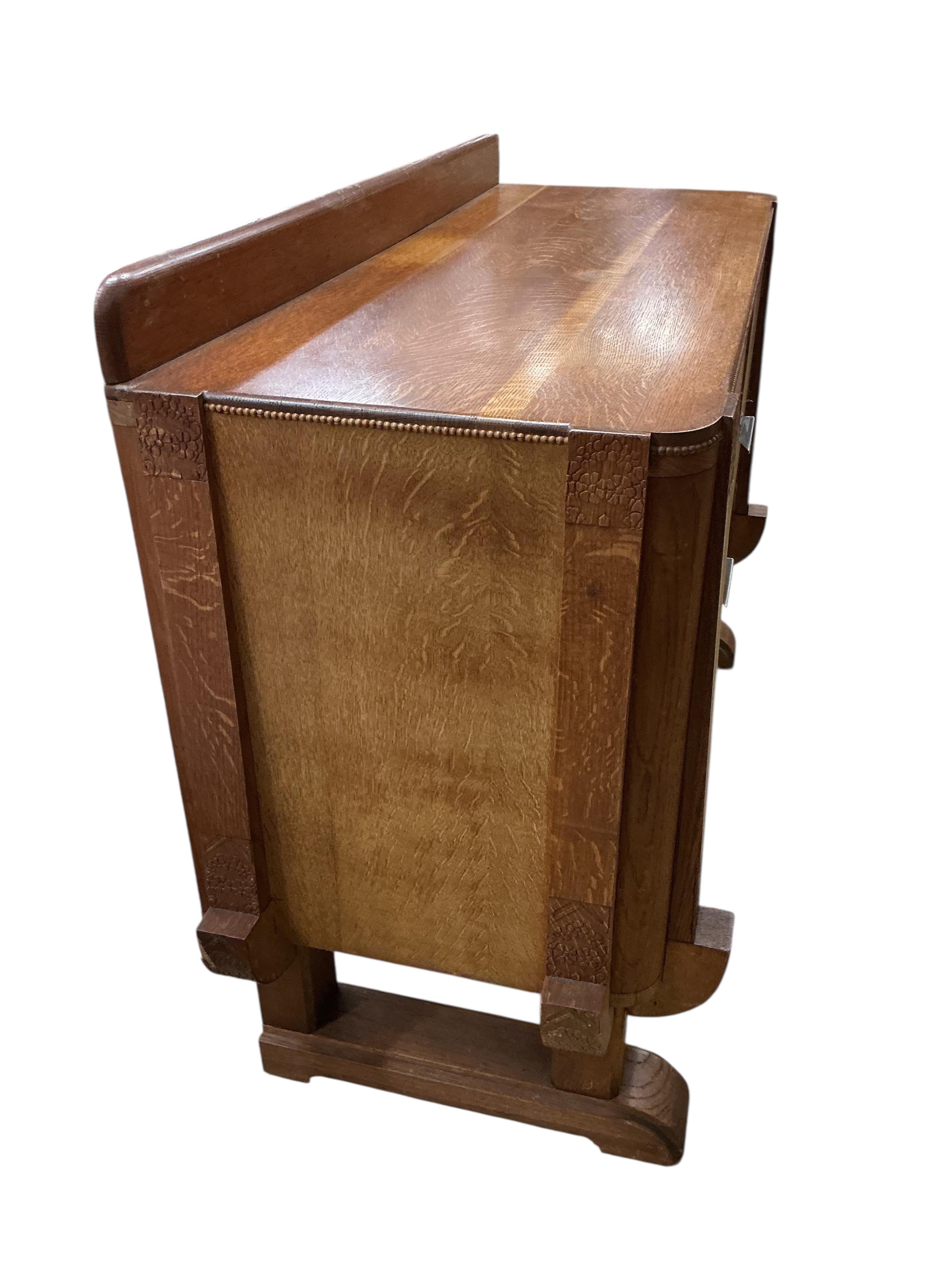 An Art Deco oak sideboard, width 134cm, depth 53cm, height 100cm